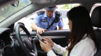 Body cam footage from cop who pulled over woman for holding a phone in her other hand