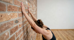How to Use a Wall in Yoga for More Stability and Better Alignment